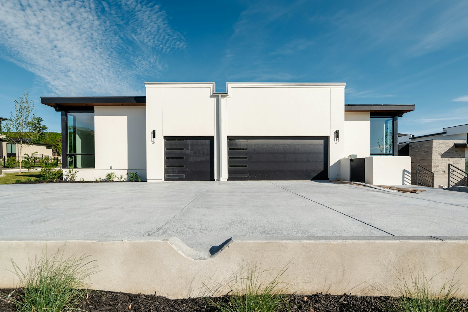 Concrete driveway in front of a family home